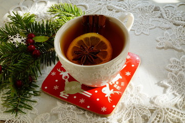 Hot tea  with spices on a wooden background. Selective focus.Still life, food and drink, seasonal and holidays concept.
