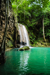 Deep forest waterfall with clear water in erawan national park kanchanaburi ,Thailand nature travel