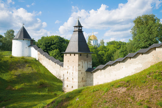 At the walls of the Holy Dormition Pskovo-Pechersky Monastery on a sunny June day. Pechory, Russia
