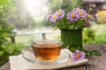 A Cup of tea on a wooden table.