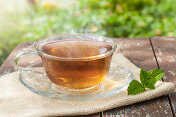 A Cup of tea on a wooden table.