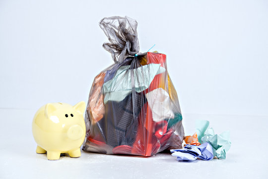 garbage bag with defferent content with piggy bank