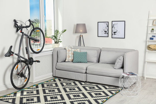 Modern living room interior with bicycle near wall