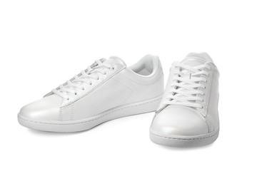 Pair of trendy sneakers on white background
