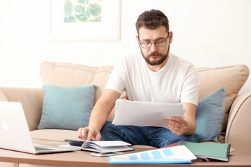 Young man working at home