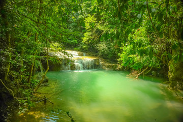Fototapeta na wymiar Deep forest waterfall in erawan national park kanchanaburi ,Thailand nature travel