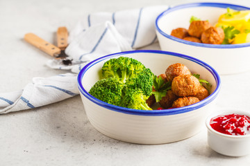 Swedish meatballs with broccoli, boiled potatoes and cranberry sauce. Swedish  traditional food concept.