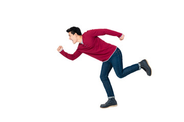 Fototapeta na wymiar Young energetic Asian man in casual clothes running on white background
