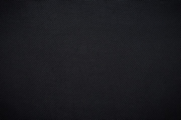 Black woven carbon fiber sheet texture background