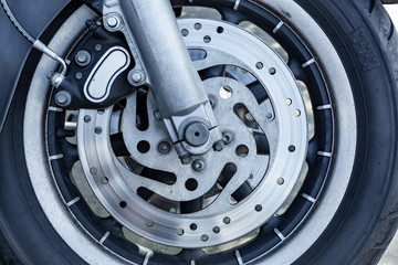 Fototapeta premium Close up of Vintage motorcycle parking on the road. Croped view, wheel
