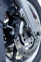 Close up of Vintage motorcycle parking on the road. Croped view, wheel