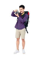 Young handsome traveler taking a photo