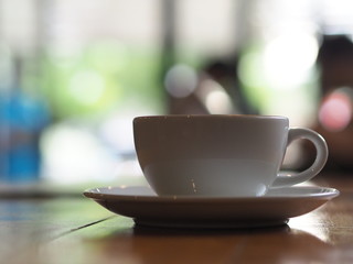 cup of coffee on wooden table