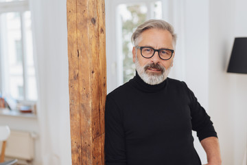 Man staring intently at the camera with a frown