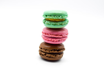 macarons stacked, sweet colorful macarons on white background