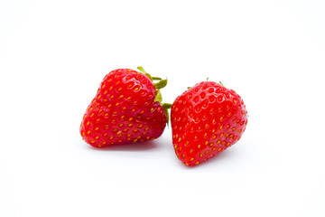 Two whole strawberries isolated on white background