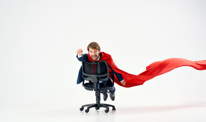 a man in an office chair in a red coat