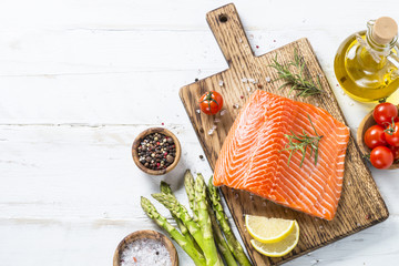 Salmon fillet with ingredients for cooking -  fresh vegetables a