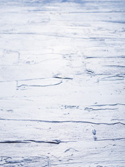 Dark blue acrylic painted wooden background. Sea water effect or wet road pavement