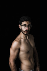 Fototapeta premium Muscular young man posing with definition