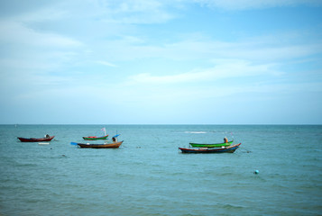 Five small fishing boat parking on the sea