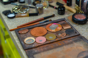 set of make up products lying on a table of a beauty salon