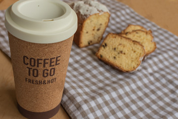 Sweet cake and coffee to go. Homemade bun.