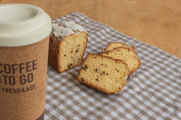 Sweet cake and coffee to go. Homemade bun.