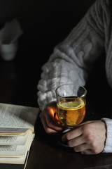 Woman gives some tea in a glass