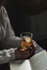 Woman gives some tea in a glass