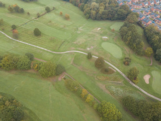 Top view green golf course/outdoor green grass field. Aerial view from flying drone.