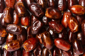 Fresh dates making a background pattern