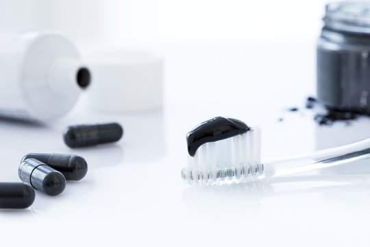 Charcoal Toothpaste On A Toothbrush