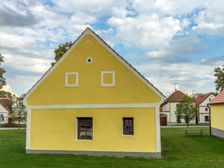 Fototapeta na wymiar Typical village house with yellow paint