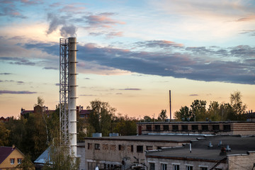 Fototapeta premium pipe factory smoke in the background of a beautiful sky