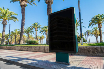 Outdoor billboard advertisement in seaside resort city mockup