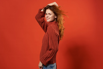 beautiful woman in red sweater side view