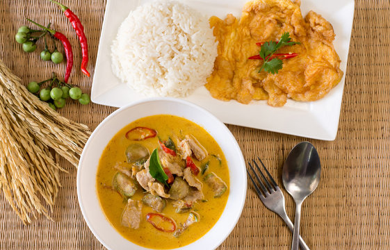 Delicious green curry with pork omelet and cooked rice,Thai food style
