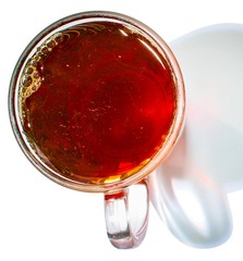 Black tea is a beautiful color in a transparent mug. View from above. 