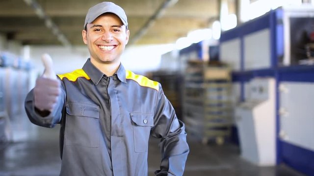 Happy worker giving thumbs up