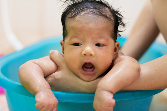 Aunty take a bath for baby girl indoor