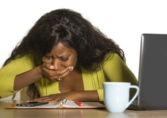 close up portrait of young sad and depressed black afro American business woman crying while...