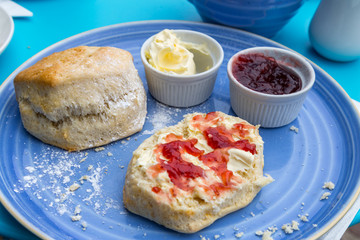 english cream tea with scones, clotted cream, marmelade and tea