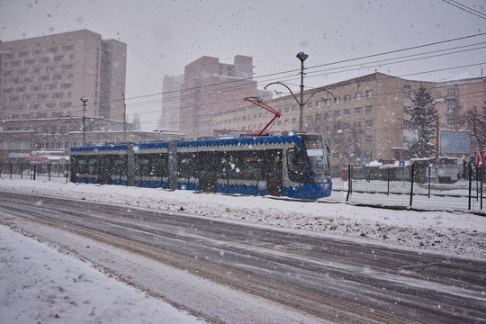 Trams at the station during heavy snowfall.