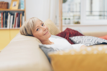 Attractive blond woman relaxing at home