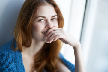 happy woman covers her mouth