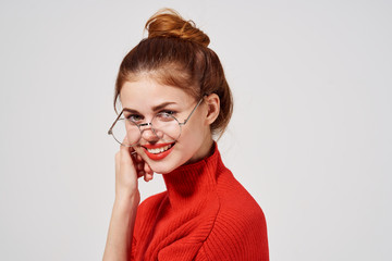 happy woman in a sweater and glasses