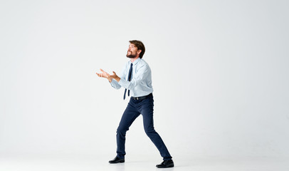 business man in full growth on a light background