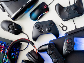 gamer workspace concept, top view a gaming gear, mouse, keyboard, joystick, headset and mouse pad...