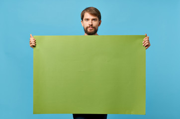 green paper machine on blue background